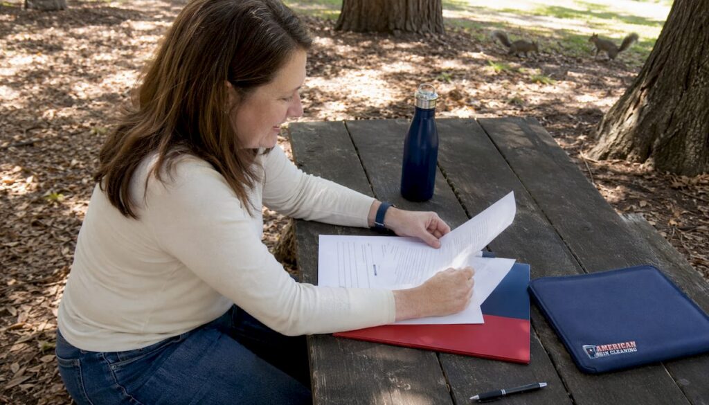 HOA board member reviewing bin policy documents